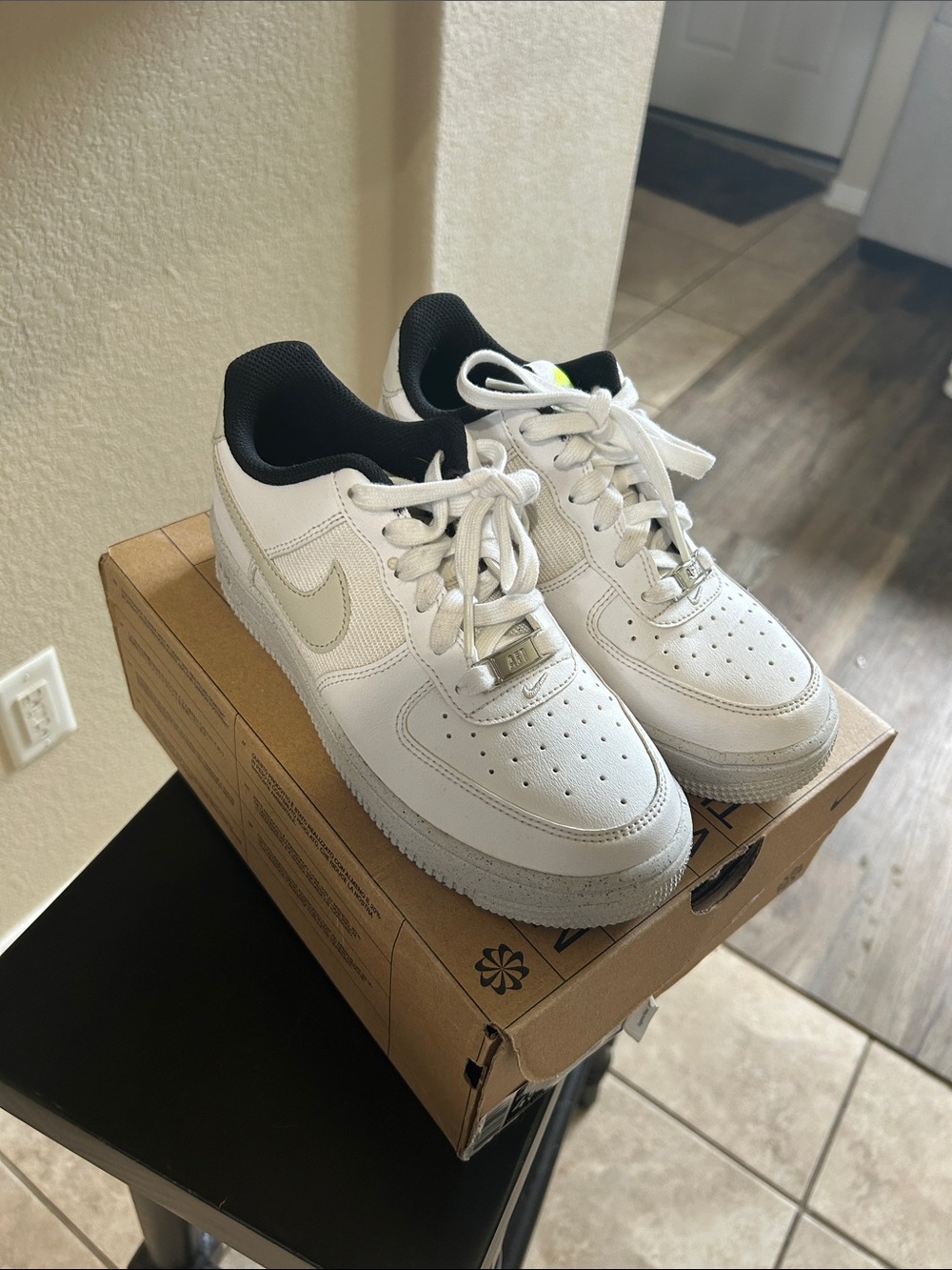 Nike Kids White Sneakers with Black Collar and Cream Swoosh 4.5